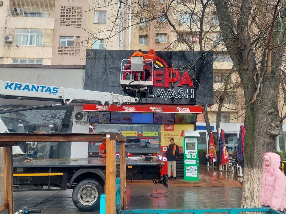 Tashkent business owners decry forced signage removals under new design code.